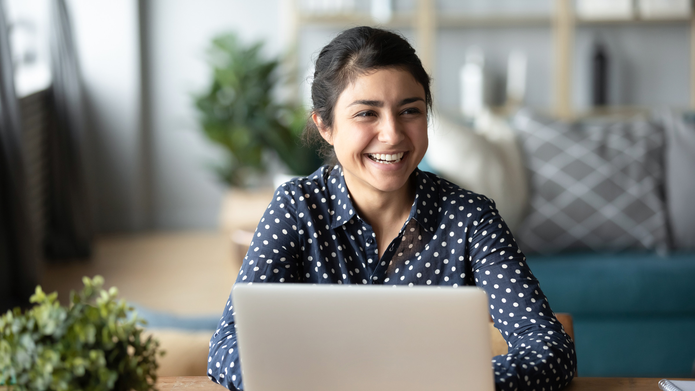 Young woman works at a web design agency in Colorado Springs.