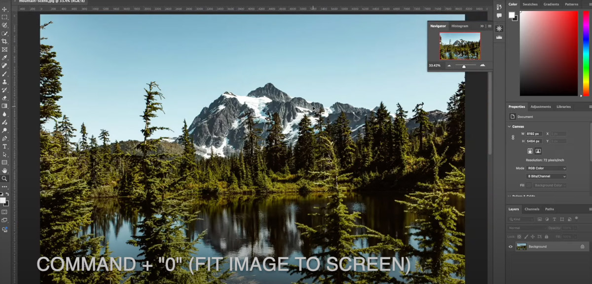 Photoshop with mountain image on screen.