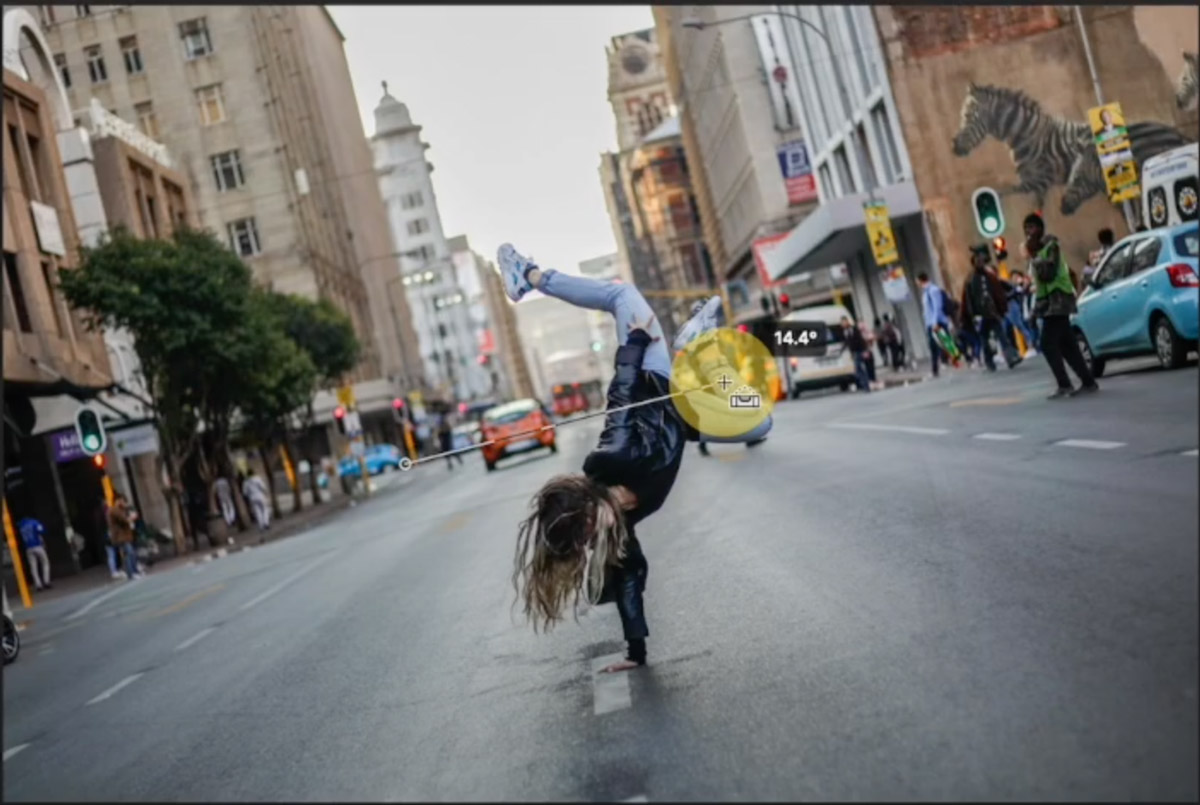 Person breakdancing on urban street.
