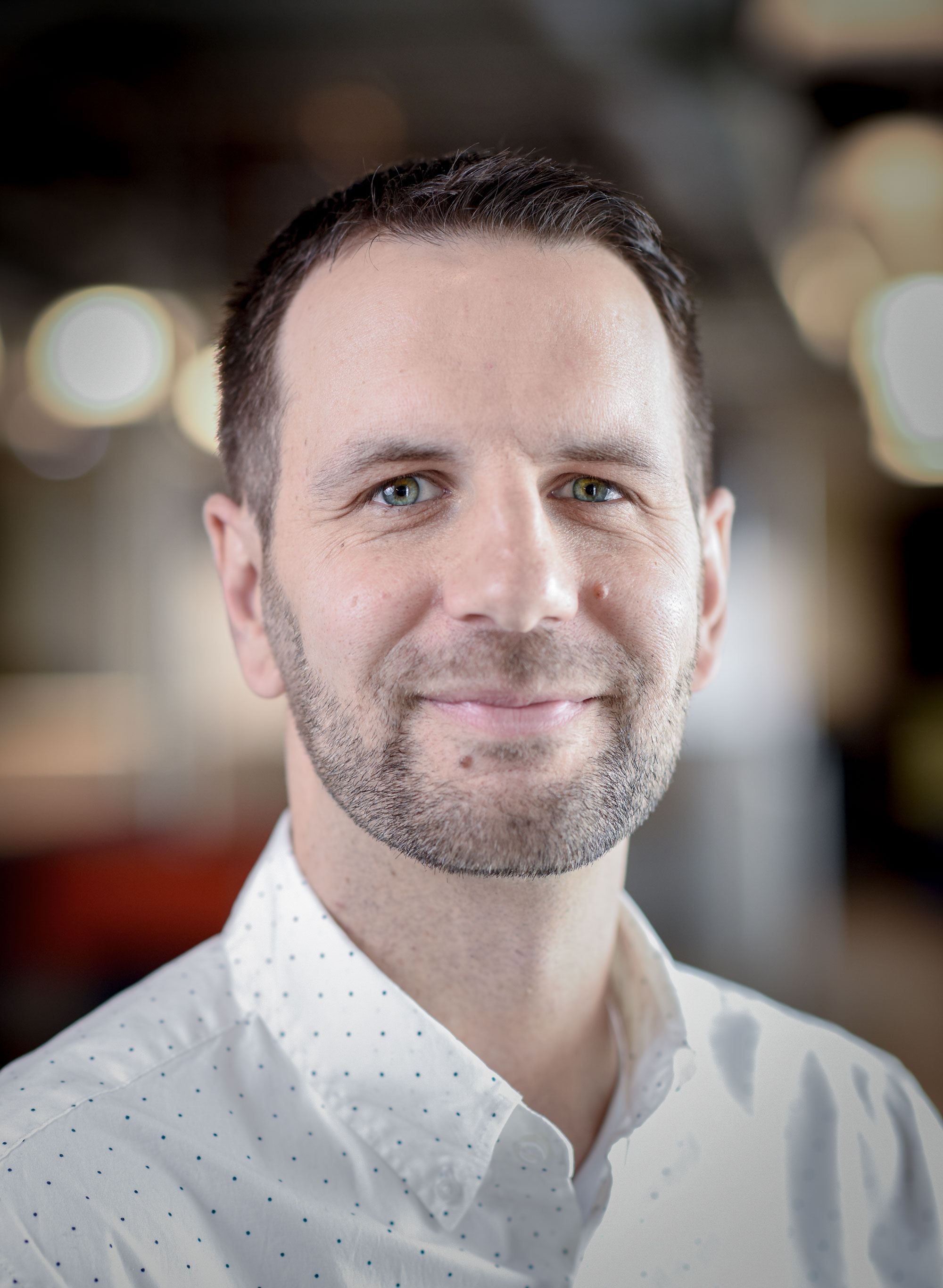Smiling man in white shirt portrait