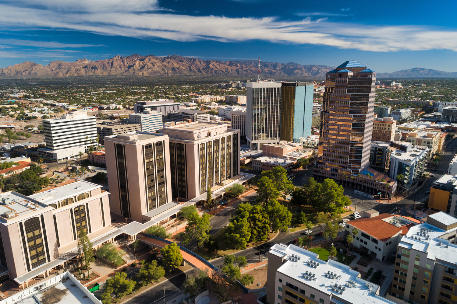 Aerial view of Tucson, Arizona skyline and nearby mountains.