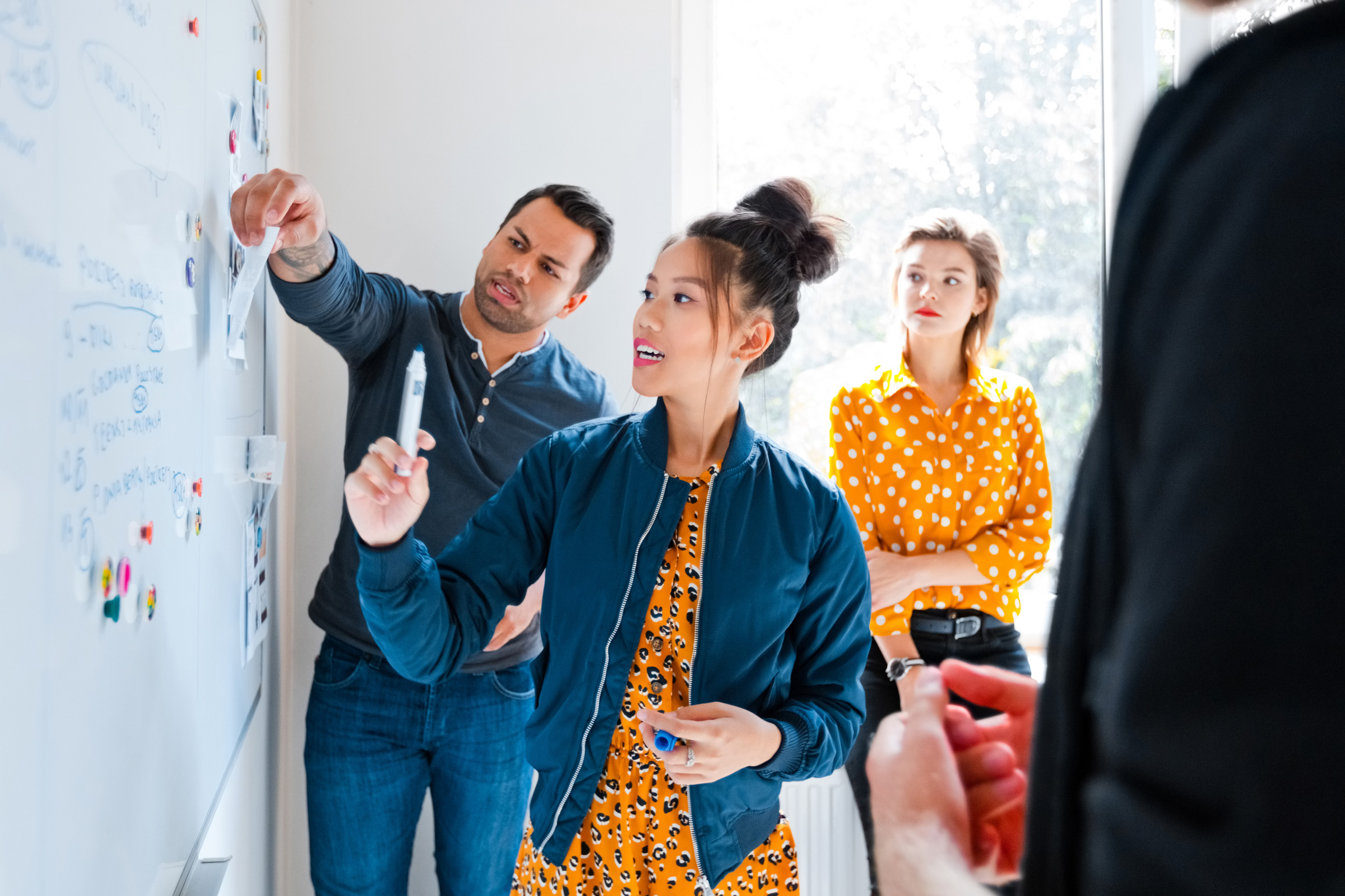 A group of website developers work on planning a website.